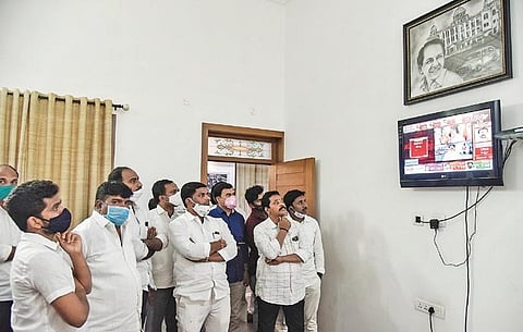 TRS workers anxiously watch the Dubbaka bypoll results on TV at TRS Bhavan in Hyderabad on Tuesday | VINAY MADAPU