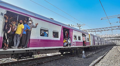 Kolkata Passengers travel via local train after the authorities resumed its services from today onwards (Photo | PTI)