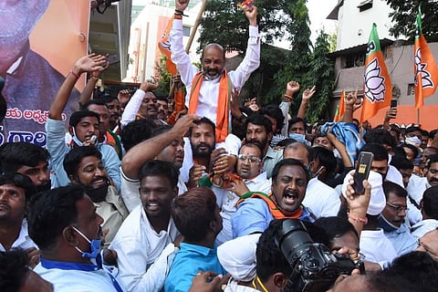 BJP MP and State president Bandi Sanjay along with party supporters celebrating at Telangana BJP office in Hyderabad on Tuesday. (Photo | RVK Rao/EPS)