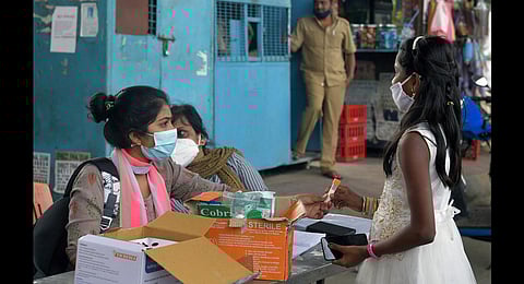 A health worker collects a sample from a child in Bengaluru. (Photo | Meghana Sastry, EPS)