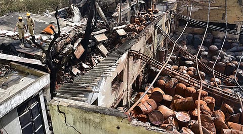Firemen inspect the factory in Bengaluru on Wednesday | Vinod Kumar T