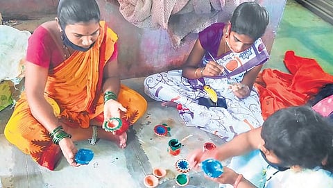 Joginis making painted clay diyas and lamps at Narayanpet
