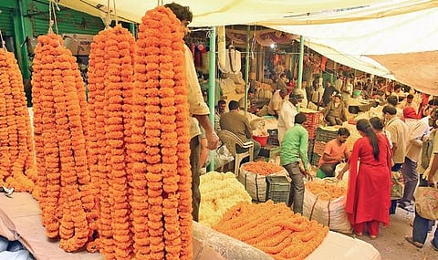Customers throng a flower market on the eve of Diwali in Hyderabad on Friday | RVK Rao