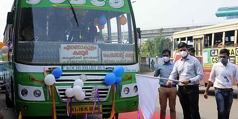Kochi Metropolitan Transport Authority CEO Jafar Malik flagging off the first smart bus functioning on CNG fuel at Vyttila Mobility Hub. (Photo| A Sanesh, EPS)