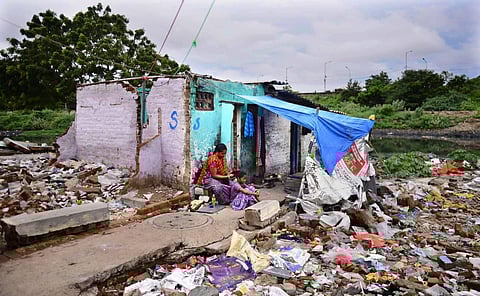 A family living amid uncleared debris at Sathyavani Muthu Nagar in Chennai. (Photo| Debadatta Mallick, EPS)