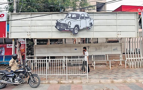 A cutout of TRS’ election symbol ‘car’ pasted atop a bus stop in Hyderabad, ahead of the GHMC polls | Vinay Madapu