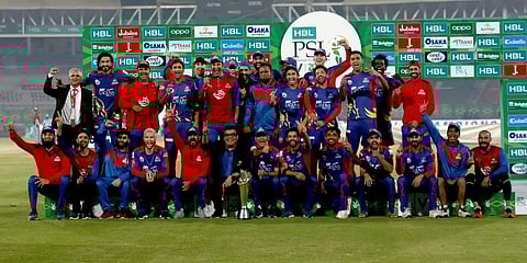 Karachi Kings officials and players pose with the winning trophy after the final of the PSL T20 cricket match against Lahore Qalandars at National Stadium in Karachi. (Photo | AP)