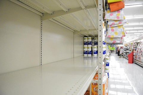 A section of shelving that normally holds paper towels sits empty at Redner's in Schuylkill Haven (Photo | AP)
