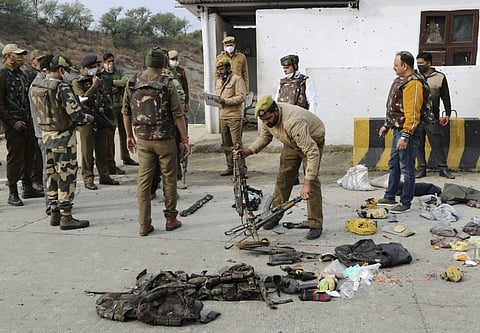 Security personnel inspect the site of encounter at Nagrota Ban toll plaza in Jammu Thursday Nov. 19 2020. (Photo | PTI)