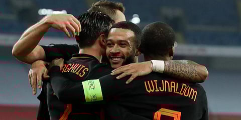 Netherlands' Steven Berghuis (L) and Memphis Depay celebrate with Georginio Wijnaldum who scored his side's second goal against Poland during the Nations League match in Chorzow. (Photo | AP)