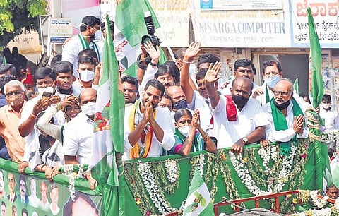 JDS leader H D Kumaraswamy takes part in a roadshow for party candidate Ammajamma, at the Sira Assembly constituency, on Sunday | KPN