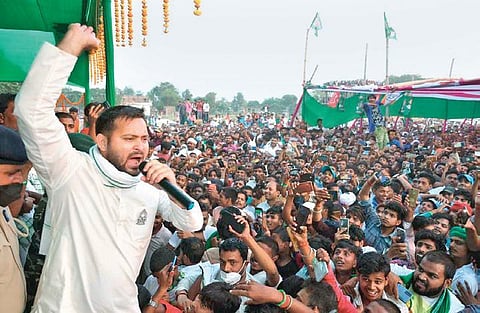 RJD leader Tejashwi Yadav and LJP chief Chirag Paswan (right) address election rallies on Sunday | express/PTI