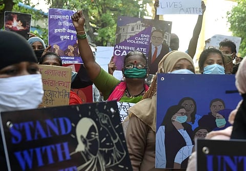 Activists hold placards and shout slogans during a protest against the death of Hathras gang rape victim. (File Photo | PTI)