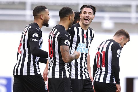 Newcastle's Callum Wilson, 2nd left is congratulated by Newcastle's Fabian Schaer, 2nd from right after scoring his side's second goal. (Photo | AP)