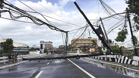 Electrical poles are toppled due to strong winds from Typhoon Goni in Daet, Camarines Norte province, central Philippines on Sunday. (Photo | AP)
