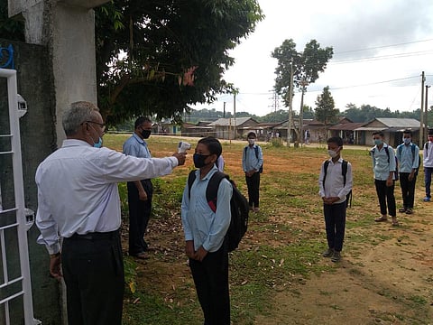 School students being scanned at the gates. (EPS)