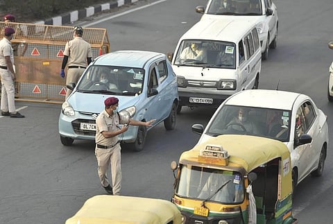 Delhi Civil Defence volunteers stop commuters for not wearing masks in public places in New Delhi Thursday Nov. 19 2020. (Photo | PTI)
