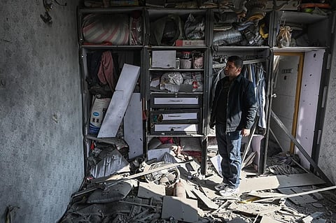 A man inspects a damaged house after several rockets land at Khair Khana, north west of Kabul on November 21, 2020. (File Photo | AFP)