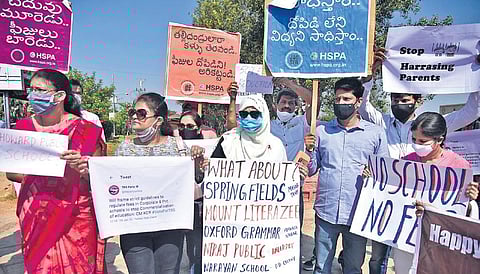 Members of Hyderabad School Parents Association stage a silent protest, demanding that the State government take action against schools violating GO 46 |RVK Rao