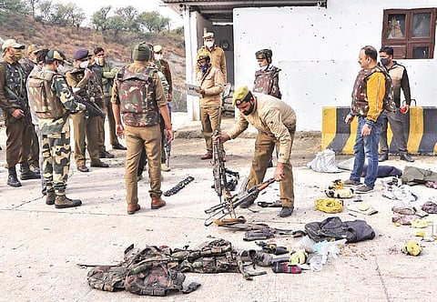 Security personnel inspect the site of encounter at Nagrota Ban toll plaza in J&K. Four terrorists were killed in an encounter with security forces | PTI