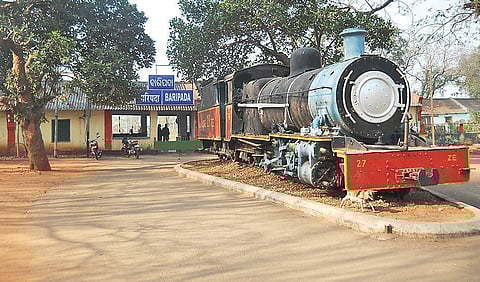 Two narrow gauge steam engines, depicting the history of railways in the district, can be seen near Baripada railway station.