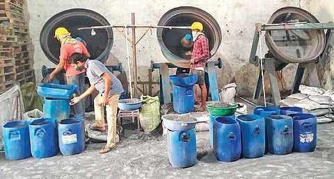 Workers at Sahu’s RHA manufacturing mill.