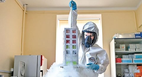 An employee works on a Covid-19 vaccine in Moscow, Russia. (File Photo | AP)