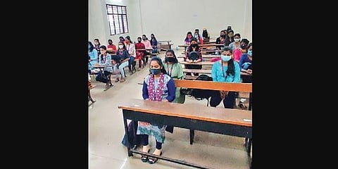 Students wear masks and sit at some distance from each other. (Photo | EPS)