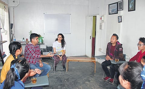 Shravan Charya with students at a school in Manipur