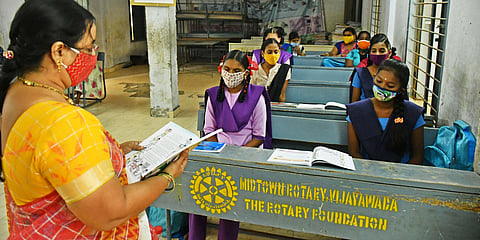 Students of class VIII attend class in Vijayawada. (Photo | Prasant Madugula, EPS)