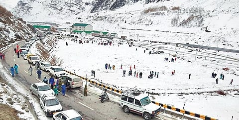 Tourists visit snow-covered fields near Atal Tunnel in Sissu, Lahaul-Spiti | pti