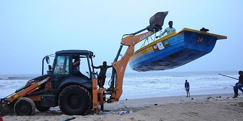 Fishing boats being shifted to safety in the view of cyclone at Kothapatnam beach in Prakasam district. (Photo | EPS)