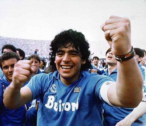 Argentine soccer superstar Diego Armando Maradona cheers after the Napoli team clinched its first Italian major league title in Naples, Italy, on May 10, 1987. (Photo | AP)