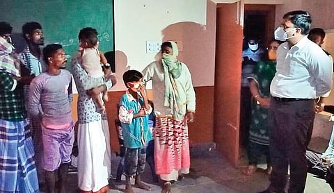 Collector KVN Chakradhar Babu interacts with evacuated people at a cyclone shelter at Kothapatnam village in Kota mandal of Nellore district on Wednesday | Express