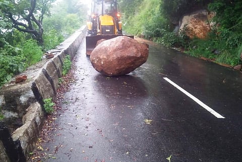 Big boulders rolled down on Yelagiri ghat road due to a minor landslide, disrupting traffic (Photo | Special arrangement)
