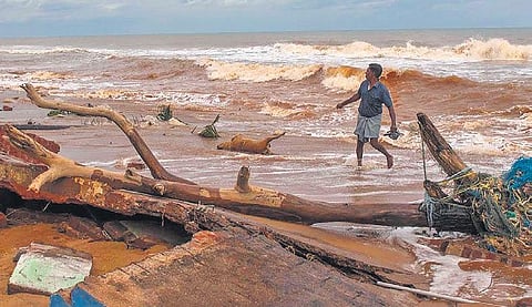 A dog carcass being dragged from the ruins of houses at Bommiarpalayam hamlet in Villupuram district in the early hours of Thursday | G PATTABI RAMAN