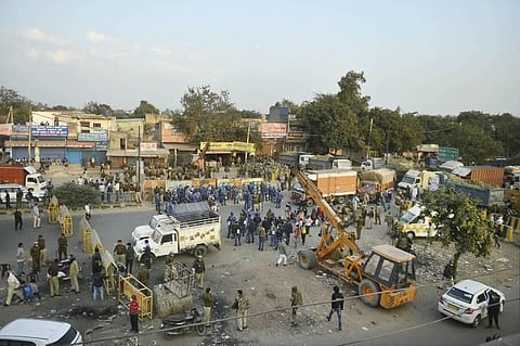 Police stand guard on the Singhu border as farmers march towards Delhi as part of 'Delhi Chalo' protest against the farm reform bills in New Delhi Thursday Nov. 26 2020. (Photo | PTI)