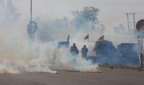 Delhi police use tear gas during the farmers protest at Singhu border in New Delhi on Friday. (Photo | Shekhar Yadav/EPS)