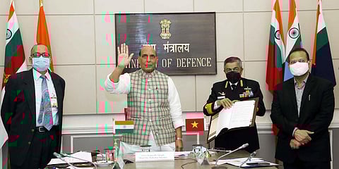 Defence minister Rajnath Singh waves to his Vietnamese counterpart General Ngo Xuan Lich via video call. (Photo| Twitter/ @rajnathsingh)