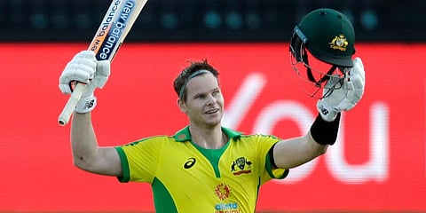 Australia's Steve Smith celebrates after scoring a century during the ODI match against India at the Sydney Cricket Ground. (Photo | AP)