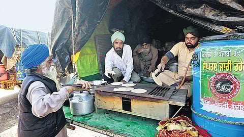 Farmers cook food at the Singhu border during their protest against the new farm laws. (Photo | Shekhar Yadav, EPS)