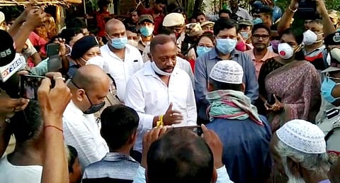 Assam Minister Parimal Suklabaidya visiting the kin of the man who died in Mizoram. (Photo | EPS)