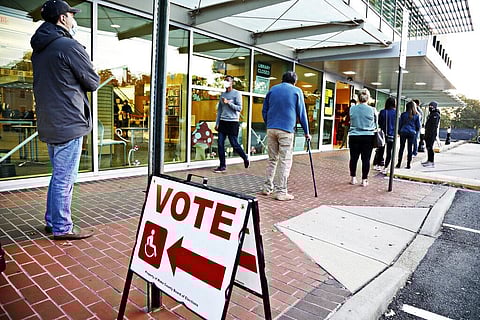 A steady line of voters wait outside of Cameron Village Library in Raleigh, N.C. early Tuesday morning, Nov. 3, 2020, to cast their ballot on Election Day. (Photo | AP)