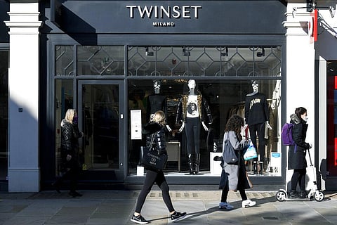 People walk past a retail shop ahead of a national lockdown for England which begins on Thursday, in Chelsea, west London, Wednesday, Nov. 4, 2020. (Photo | AP)