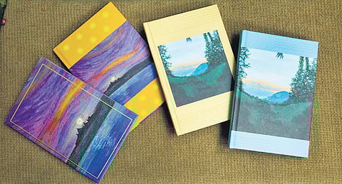 has made hardback notebooks with the cover layout carrying prints of her art work