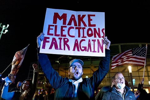 Trump supporter Jake Contos chants during a protest against the election results outside the central counting board at the tcf Center in Detroit. (Photo |AP)