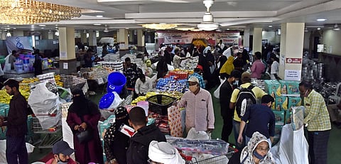 Flood victims at the Pick What You Need Mela organised by Access Foundation at Chandrayangutta on Thursday. (Photo| EPS)