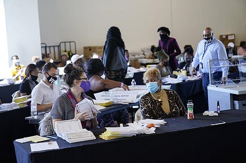 Election officials say the poll worker in the video did not crumple or discard a ballot. (Photo | AP)