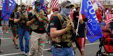Supporters of President Donald Trump rally outside the Maricopa County Recorder's Office. (Photo | AP)
