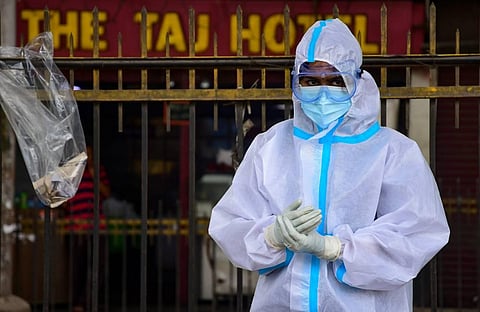 A headlthcare worker looks on after conducting COVID tests in Bengaluru. (Photo | EPS)